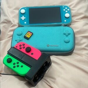 Nintendo Switch Lite with matching case, 2 controllers + charger + 2 Games
